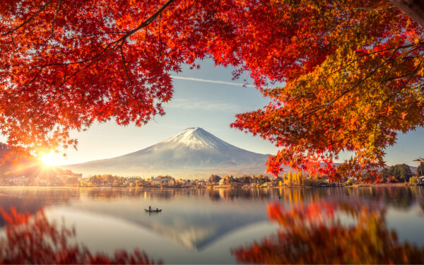 Colorful Autumn Season and Mountain Fuji with morning fog and red leaves at lake Kawaguchiko 