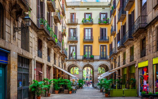 Barcelona - Spania - Old narrow street in Barcelona, Catalonia, Spain. Architecture and landmark of Barcelona. Cozy cityscape of Barcelona - shutterstock_1999722662
