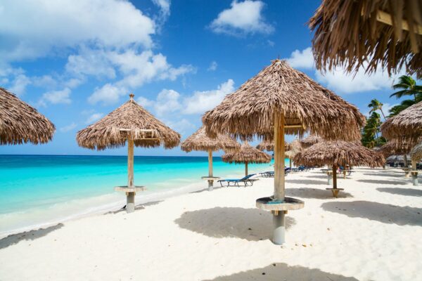Parasols,On,Idyllic,Tropical,Beach,With,White,Sand,And,Turquoise