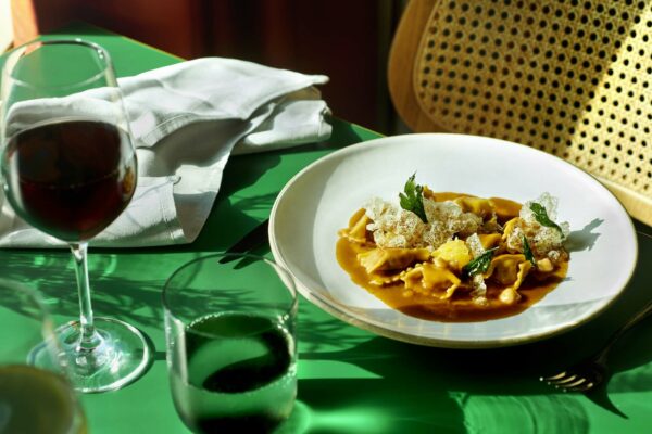 Closeup of a pasta dish and glass of red win on a table at Extra Virgin. UK Photoshoot / Atlantis Shoot Dates: Sept 27-30, 2021 Usage: Full Buyout Goal: Food & Beverages Deliverables: images, gifs, and videos TEAM Photographer: Scott Grummett https://www.scottgrummett.com Agent: Terri Manduca Food Stylist / AD: Elisa Merlo CD: Christian Schrader Art Buyer / Producer: Kathy Boos